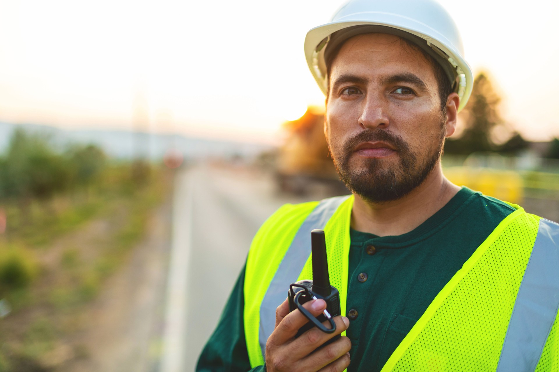 Attentive Portrait of Hispanic Workers Setting Barriers and Directing Traffic Street Road and Highway Construction Photo Series