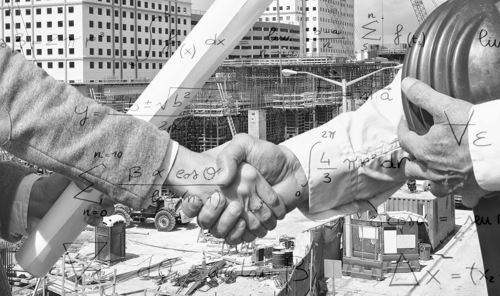 Engineers handshaking at a construction site.